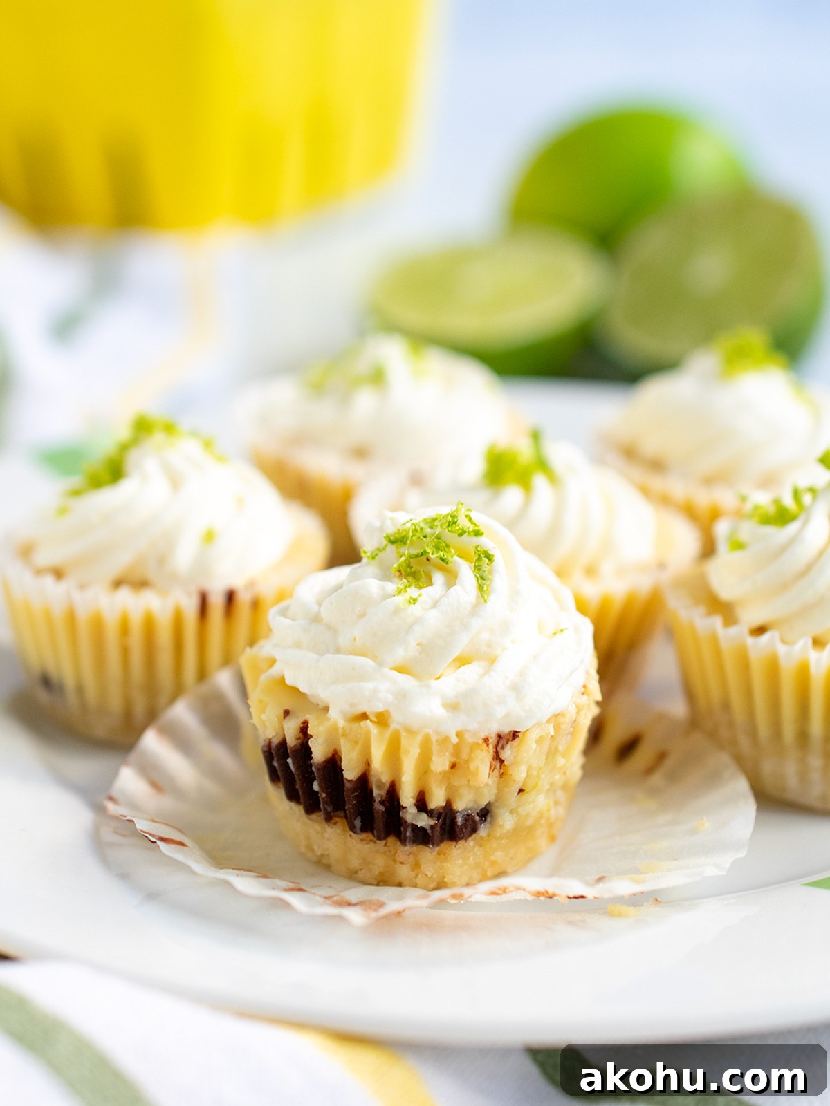 Close up side view of a mini key lime pie showing the chocolate layer.