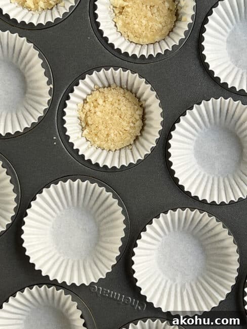 Close up of the white liner with pressed down macadamia crust in it.