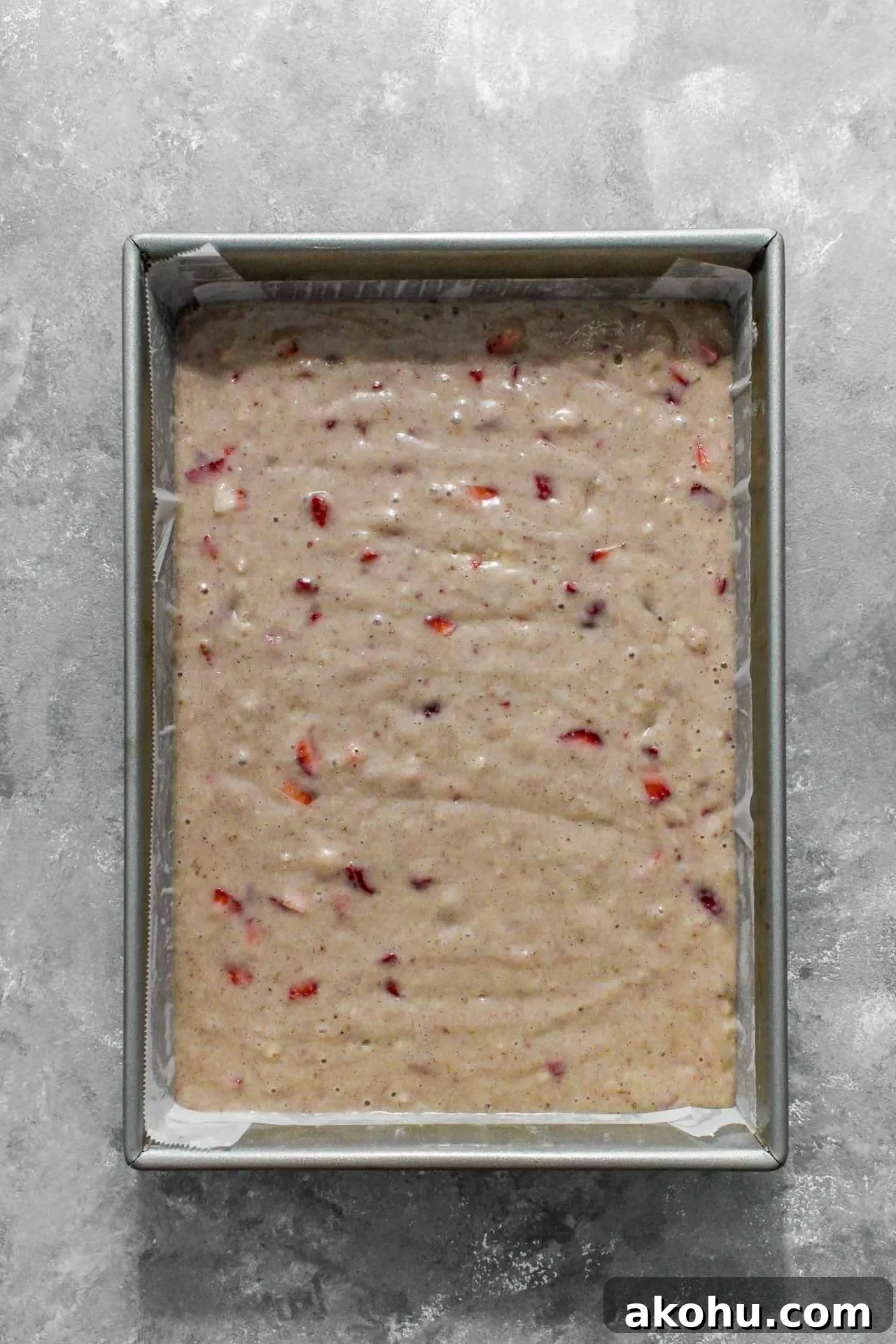 strawberry sheet cake batter in baking pan