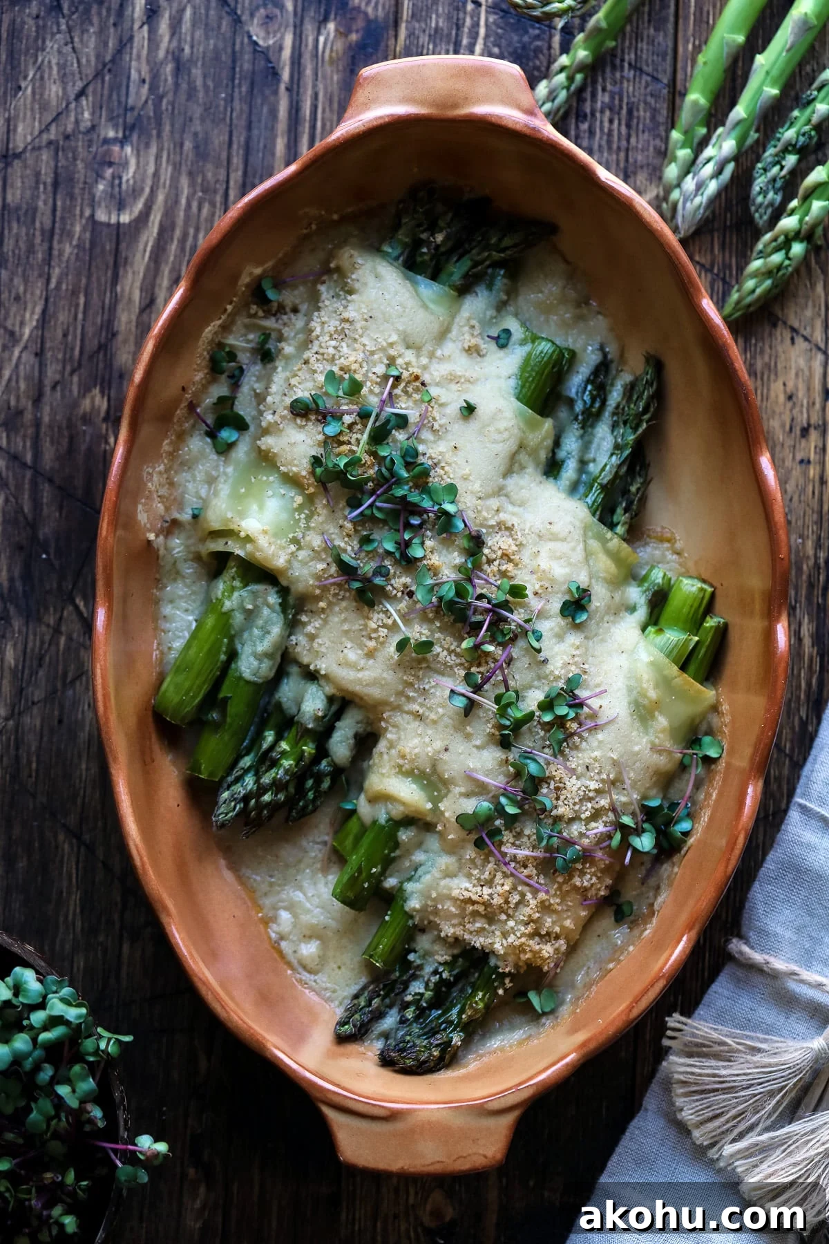 Baked asparagus cannelloni in a baking dish.