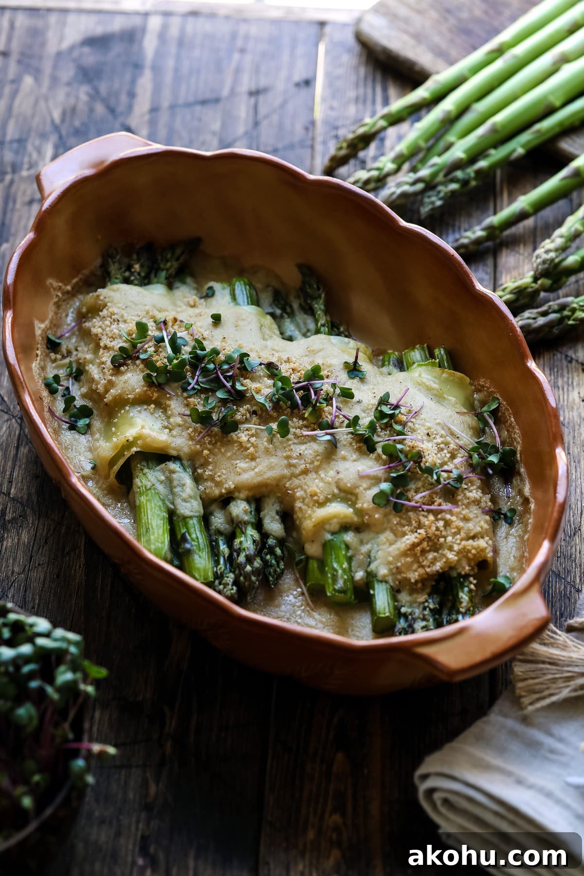 Vegetarian Cannelloni with asparagus garnished with micro greens.