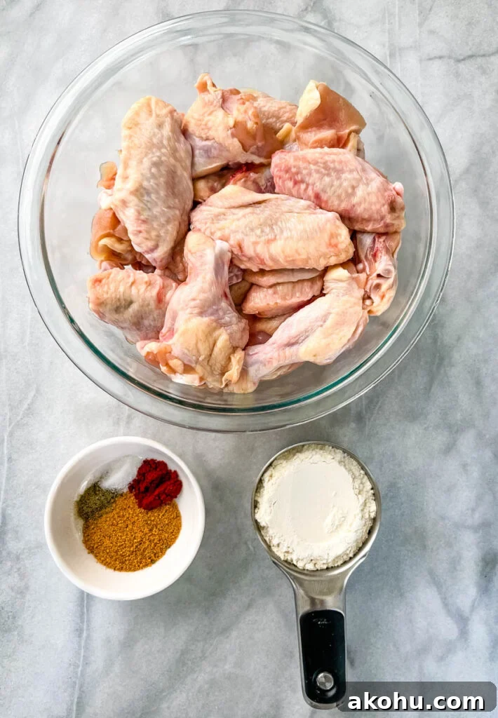 raw chicken wings in a glass bowl