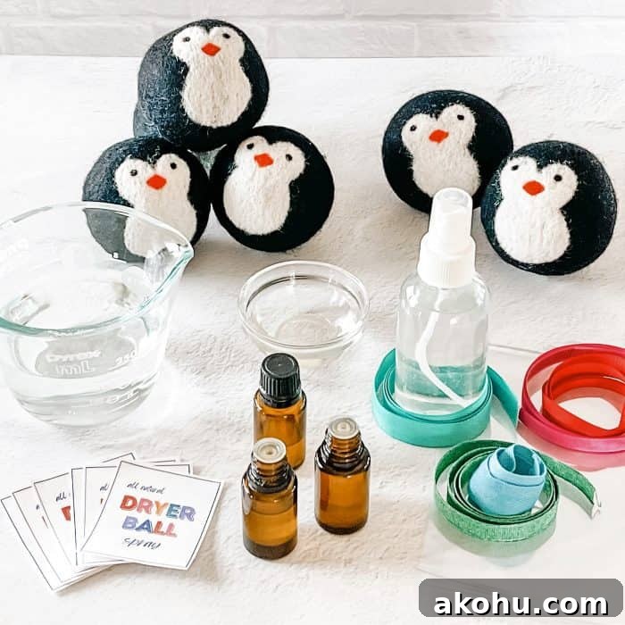 supplies to make scented dryer balls -- penguin wool dryer balls, glass 4 oz spray bottle, ribbons, cello bags, essential oils, , bottle labels, witch hazel, and distilled water