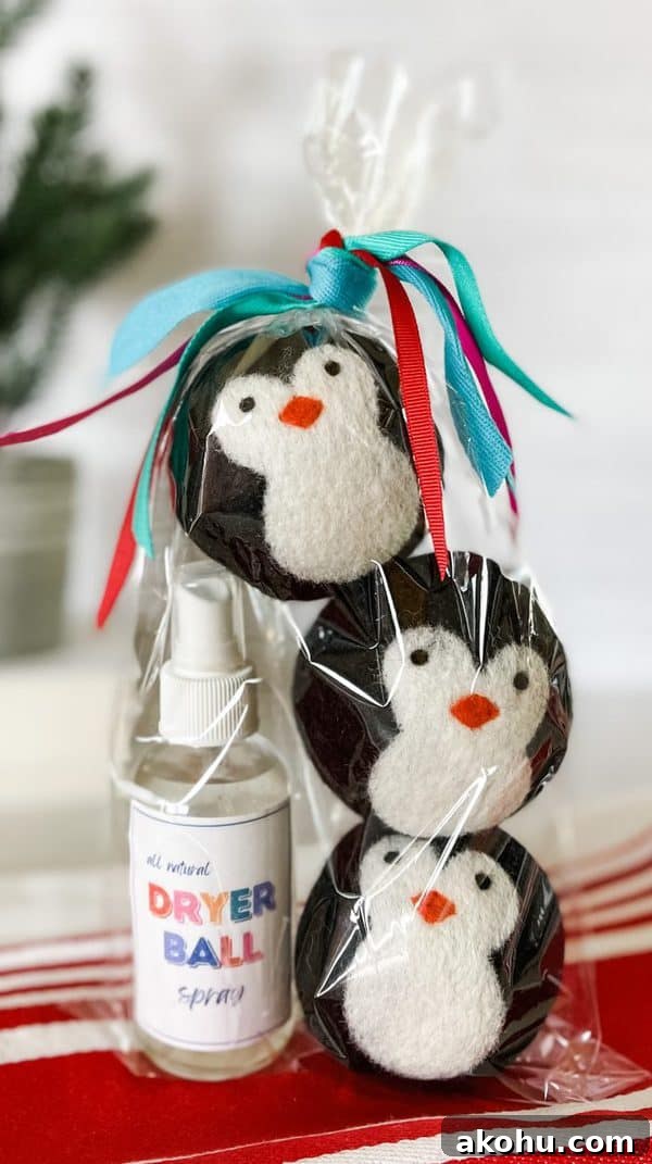 wool dryer balls are stacked inside cello gift bag along with all natural dryer ball spray