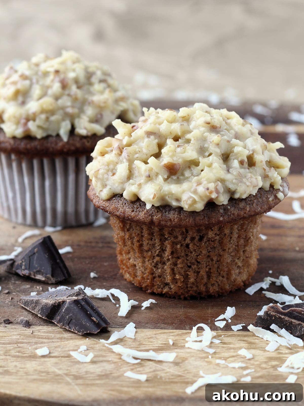 Decadent German Chocolate Cupcakes with Coconut-Pecan Frosting 6 Freshly frosted German chocolate cupcakes with thick coconut pecan topping.