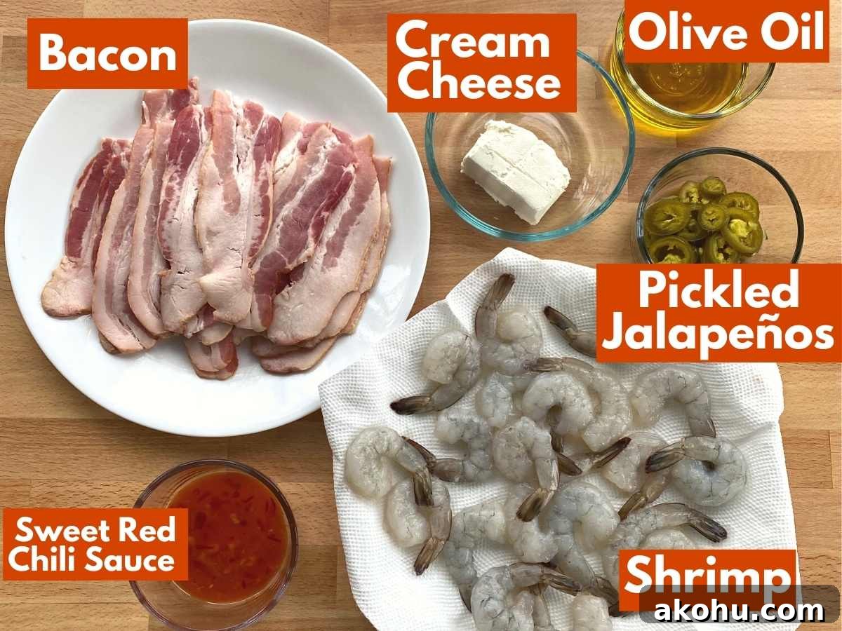Labeled ingredients to make bacon wrapped shrimp stuffed with cream cheese and jalapenos.