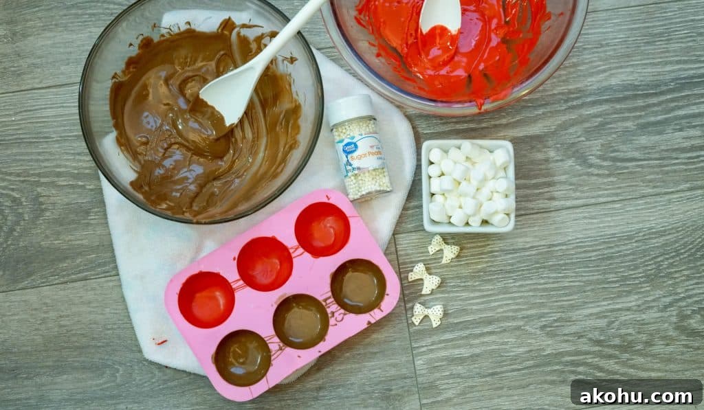melted candy melts and hot cocoa bomb molds