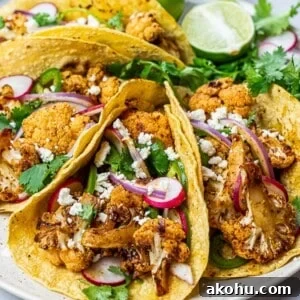 Chipotle Roasted Cauliflower Tacos with Smoky Lime Slaw 11 roasted chipotle cauliflower tacos with lime, radish, jalapenos in corn tortillas