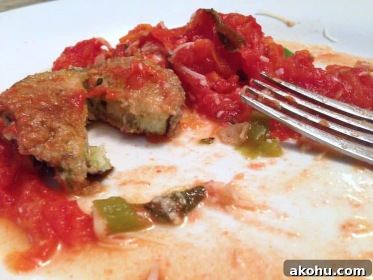 Baked Eggplant in Fresh Basil Marinara Sauce 10 A close up of a plate of food eggplant and tomatoes