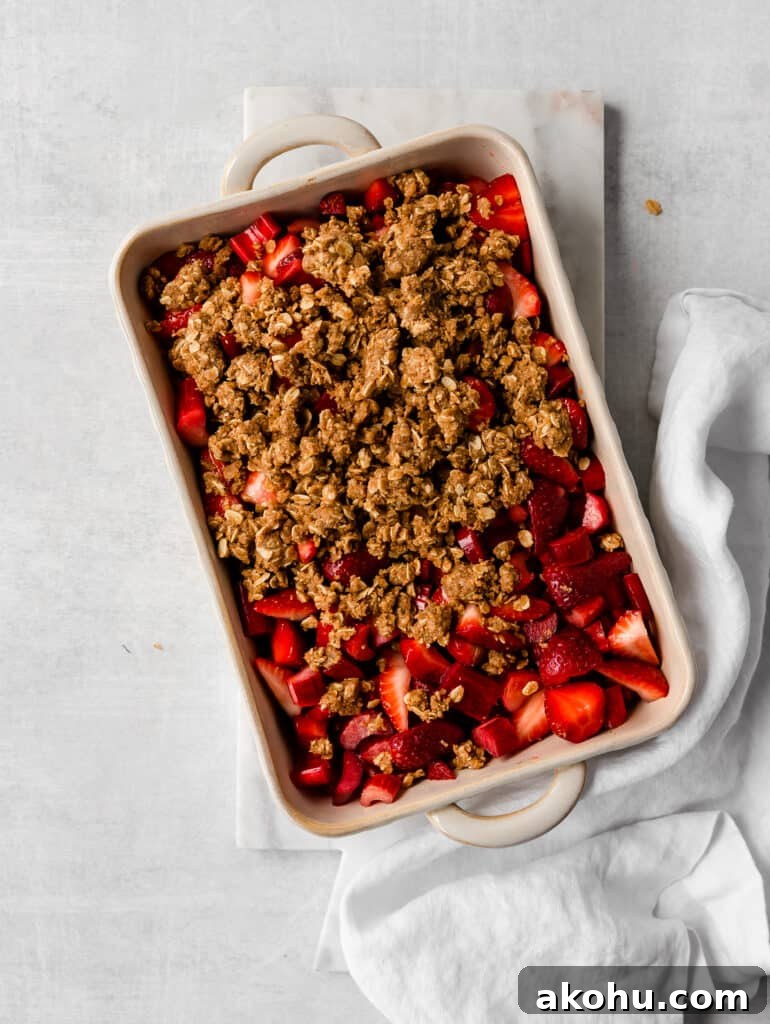 raw strawberry rhubarb crisp with topping 
