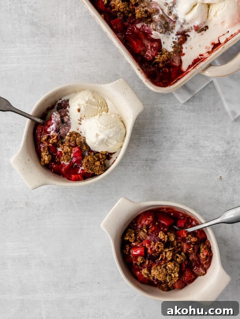 strawberry rhubarb crisp with melting ice cream 