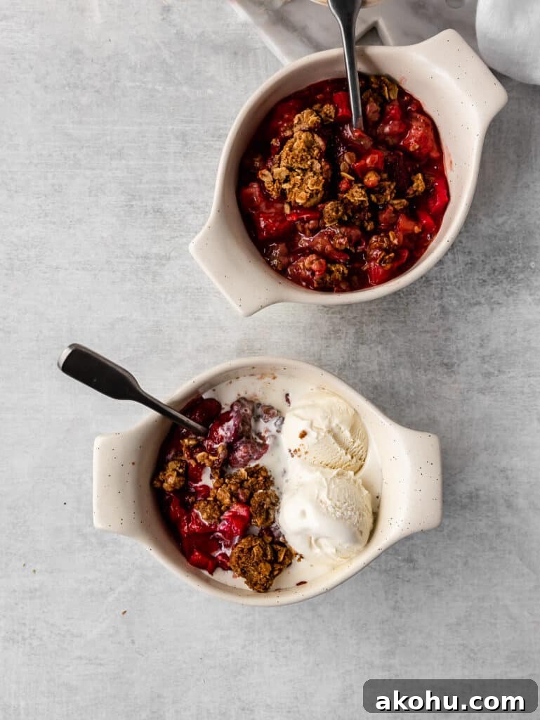 individual bowls of strawberry rhubarb crisp with ice cream 