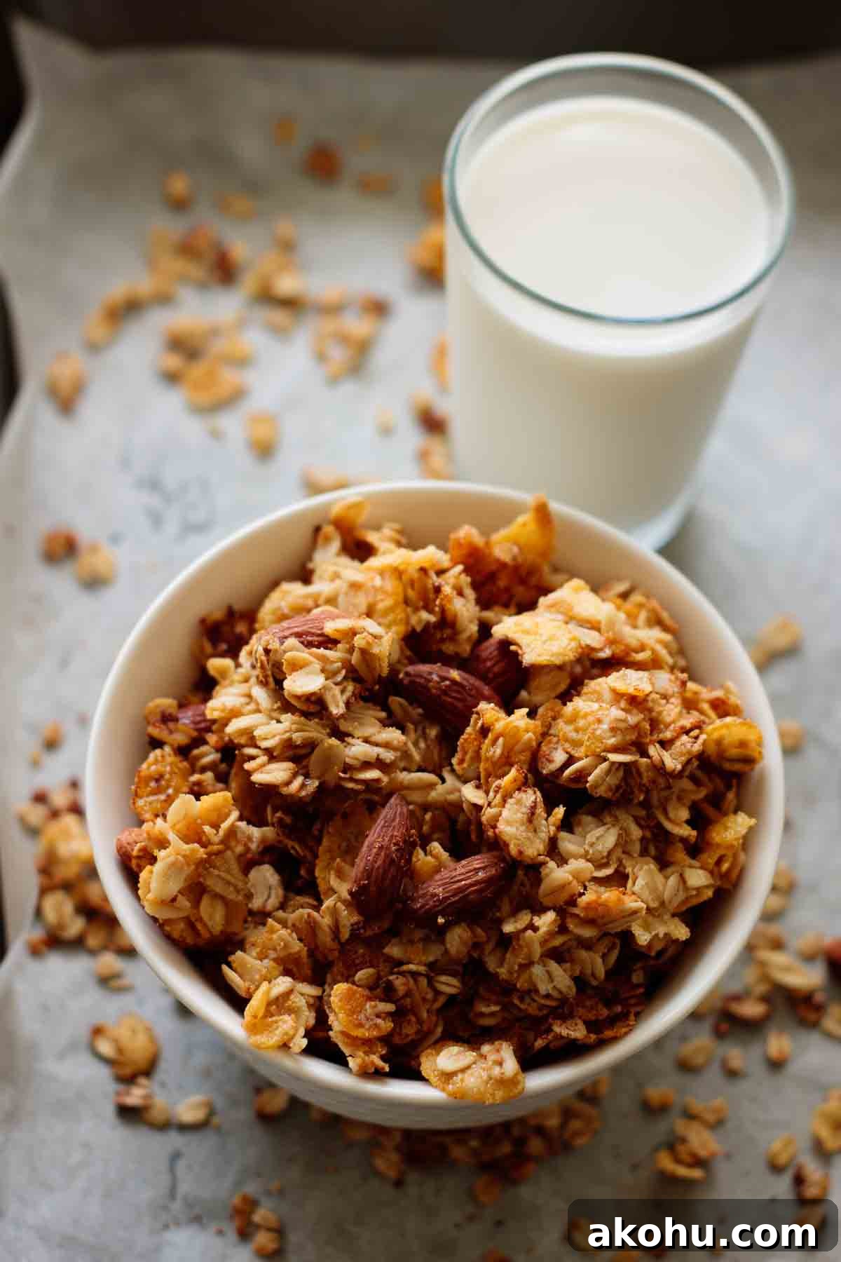 Crunchy Cornflake Granola Cereal Recipe for Breakfast 5 A bowl of granola and a glass of milk.