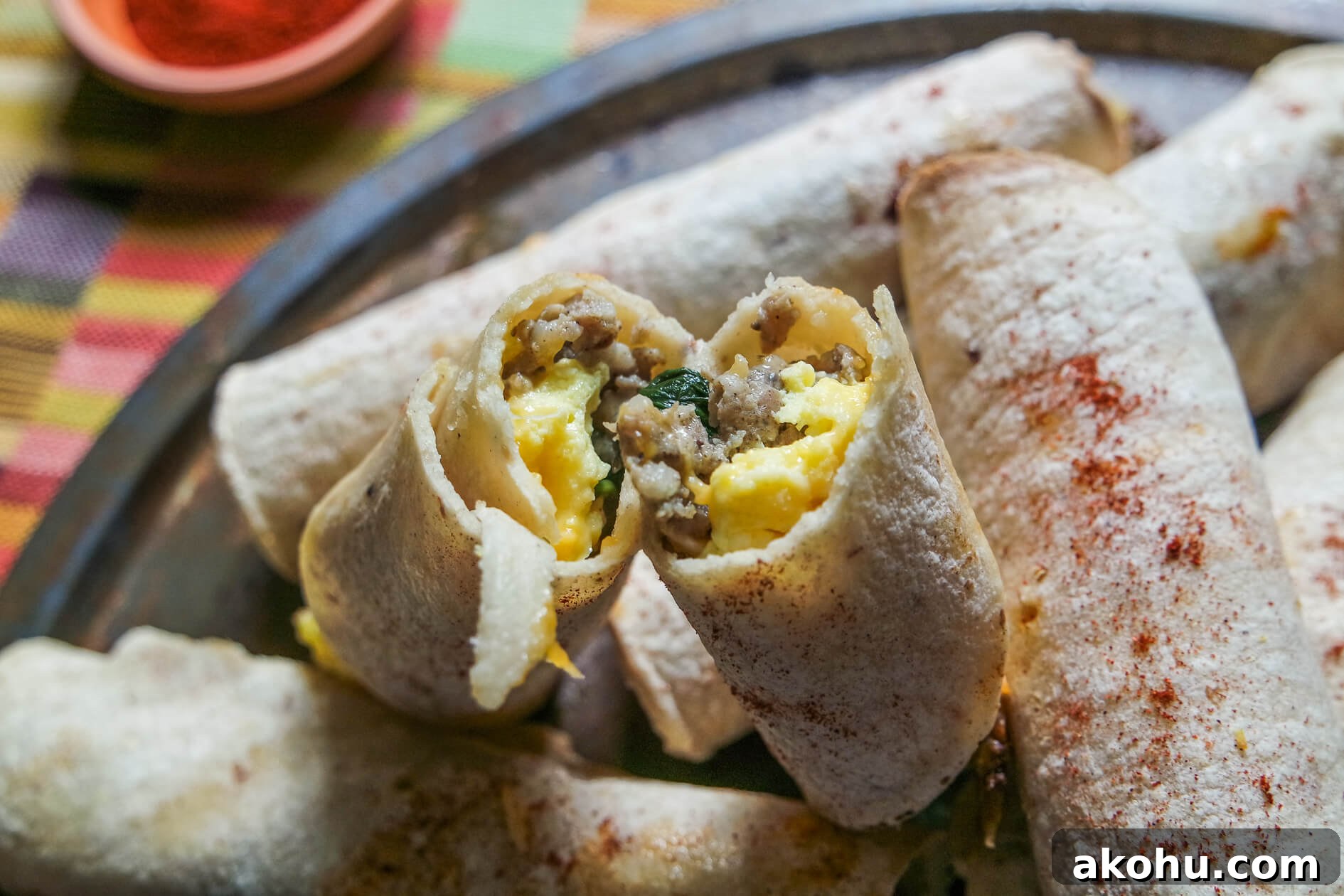 Sausage, Spinach & Egg Breakfast Taquitos — Quick Morning Recipe 2 the inside of an egg and spinach breakast taquito