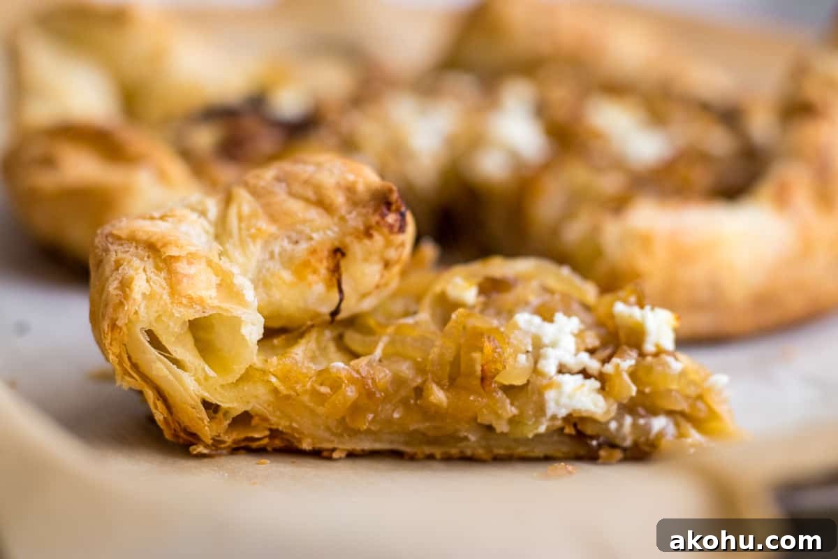 slice of onion tart on parchment paper