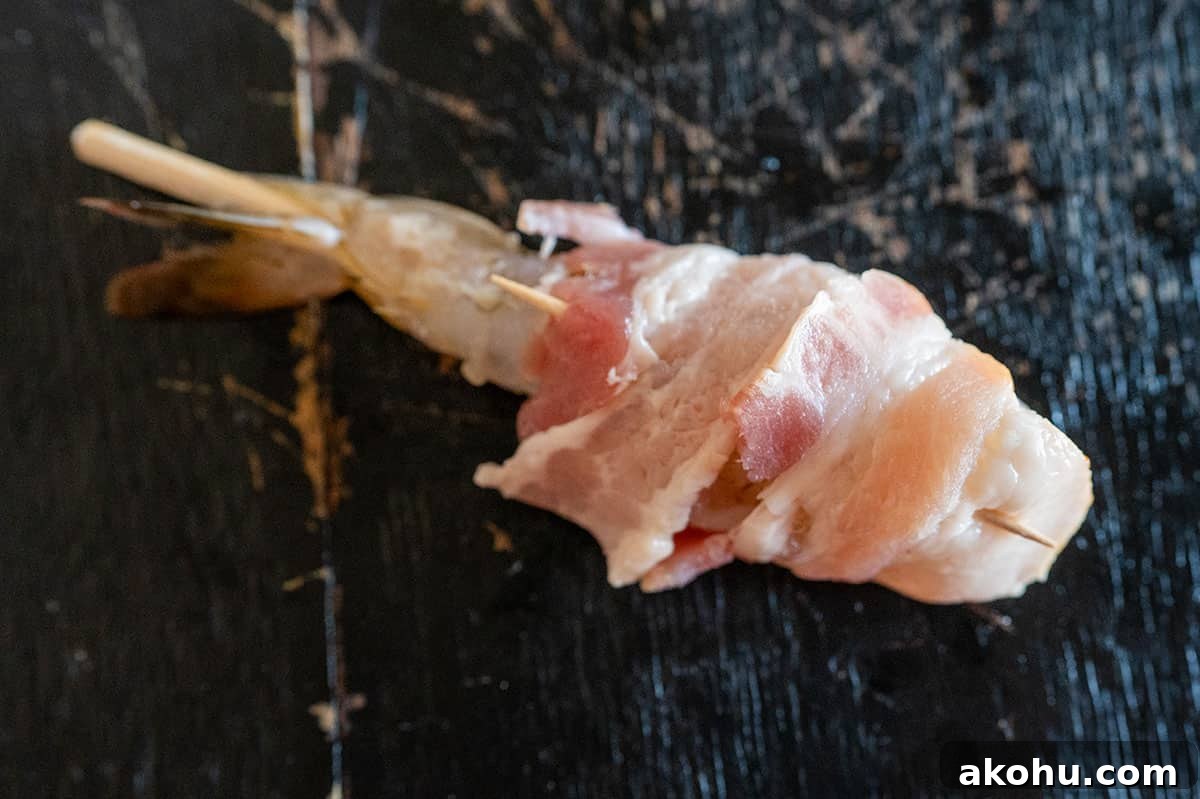 toothpick securing bacon around shrimp.