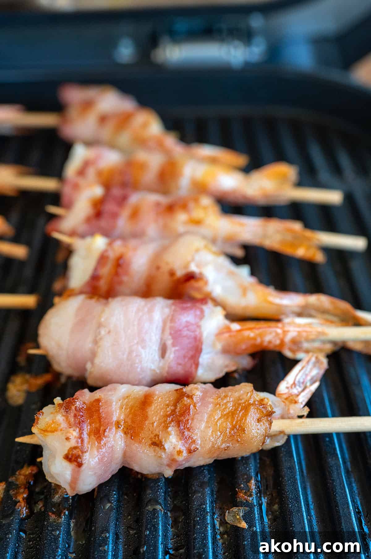 Bacon wrapped shrimp after grilling for 8 minutes.