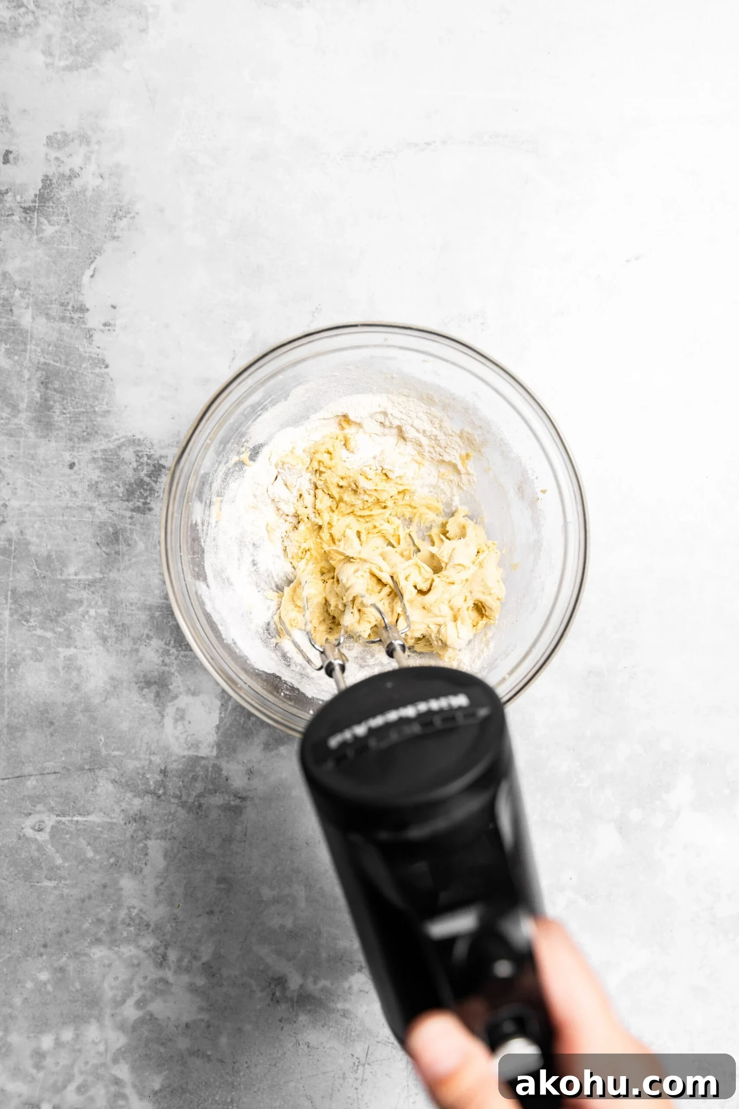 Drop-Style Vanilla Sugar Cookies: Quick Classic Recipe 7 Flour being beaten into the wet ingredients to form the sugar cookie dough.