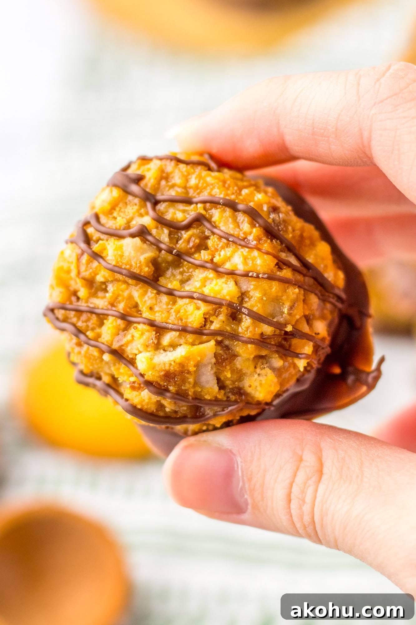 Holding a samoas truffle to show its texture up close