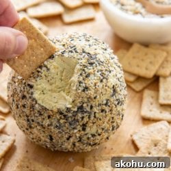 Everything Bagel Cheese Ball Recipe for Parties and Snacks 13 Everything Bagel Cheese Ball Recipe with Crackers on Wooden Board