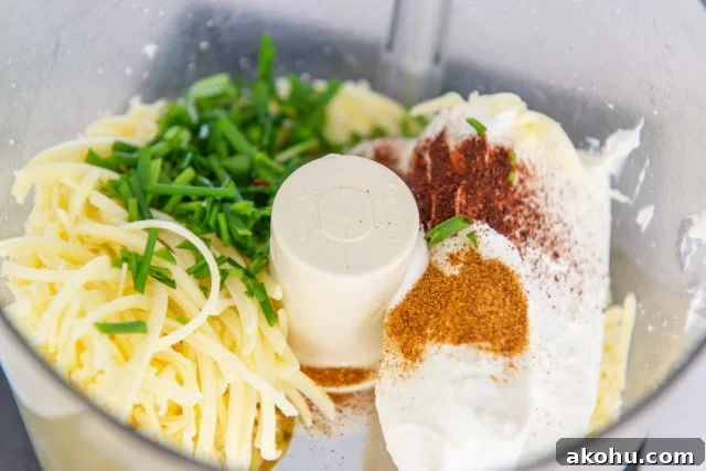 Everything Bagel Cheese Ball Recipe for Parties and Snacks 5 Cheddar, Cream Cheese, Chives, Chipotle Pepper, and Cayenne Pepper in Food Processor