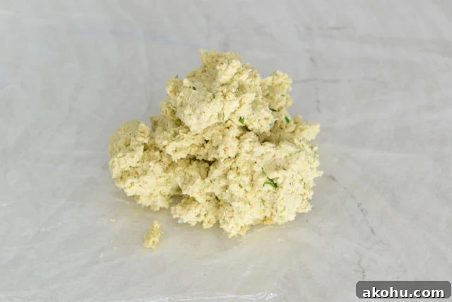 Everything Bagel Cheese Ball Recipe for Parties and Snacks 7 Cheese Ball Mixture on Plastic Wrap