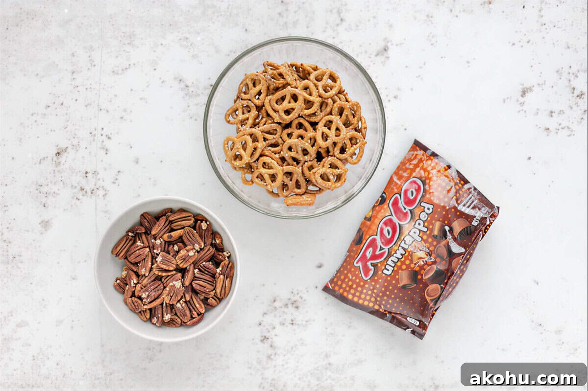 portioned ingredients for rolo pretzel turtles in bowls.