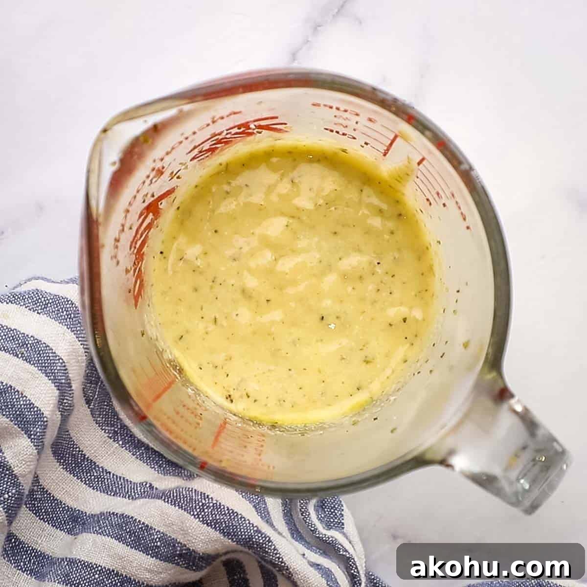 Greek Chicken Salad with Feta, Olives & Lemon Vinaigrette 9 creamy greek salad dressing in a measuring cup