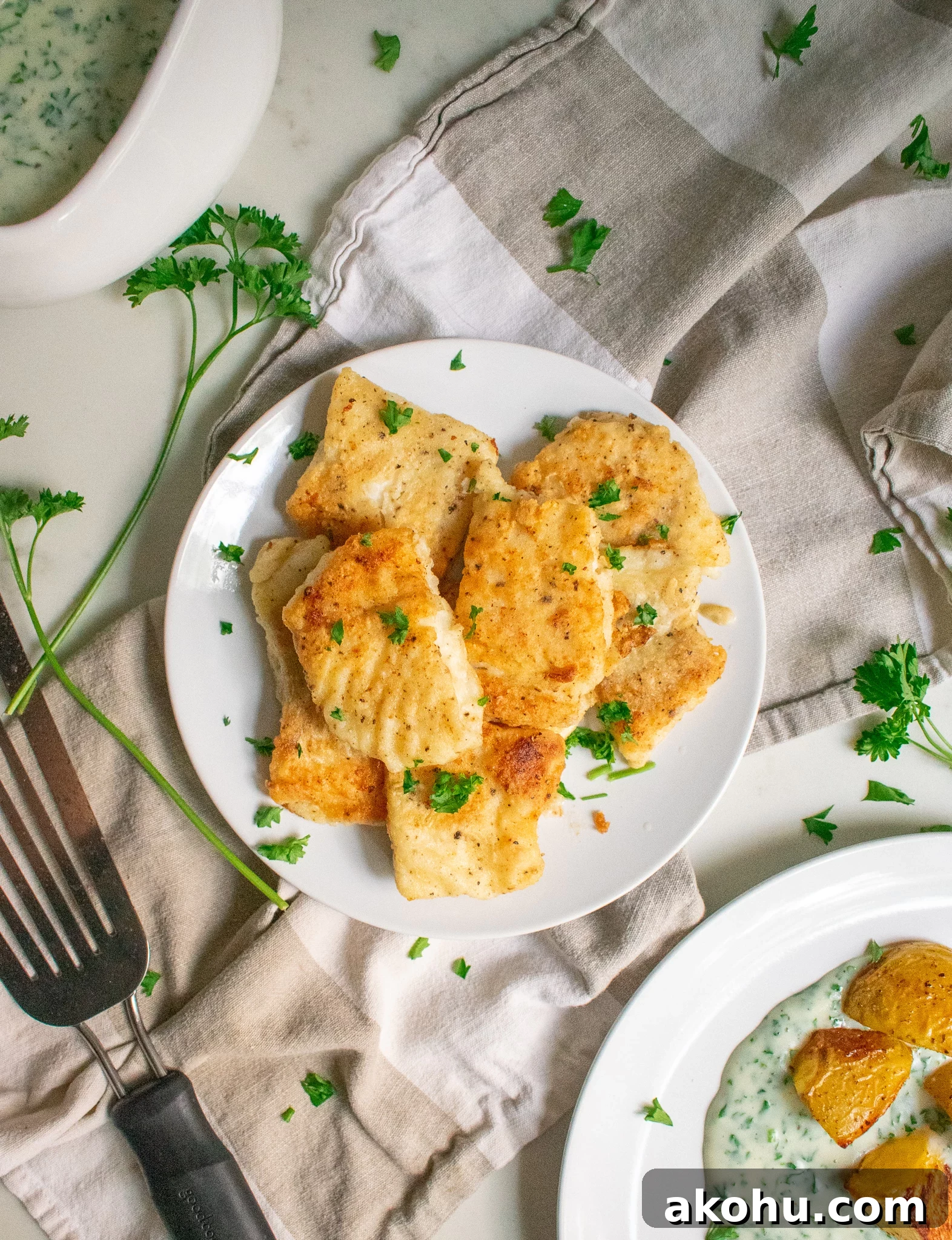 Pan fried fish on a plate.