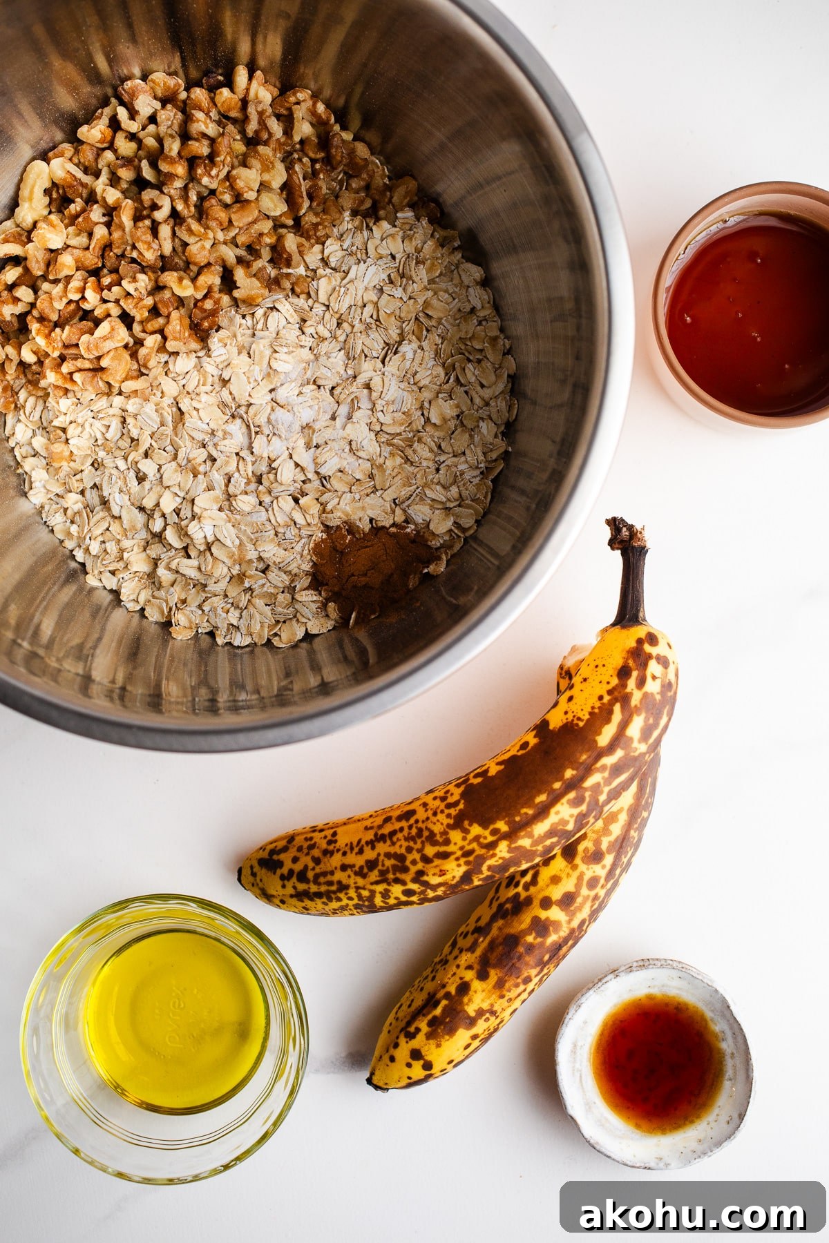 Banana Bread Granola Recipe: Crunchy, Cinnamon-Maple Cluster 4 Ingredients in small bowls for granola.