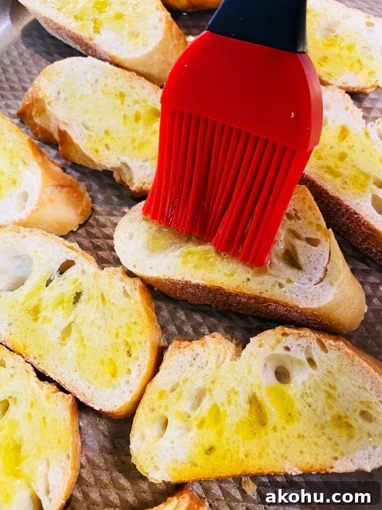 Spicy Pepper Jelly Goat Cheese Crostini Recipe 4 brushing sliced bread with olive oil
