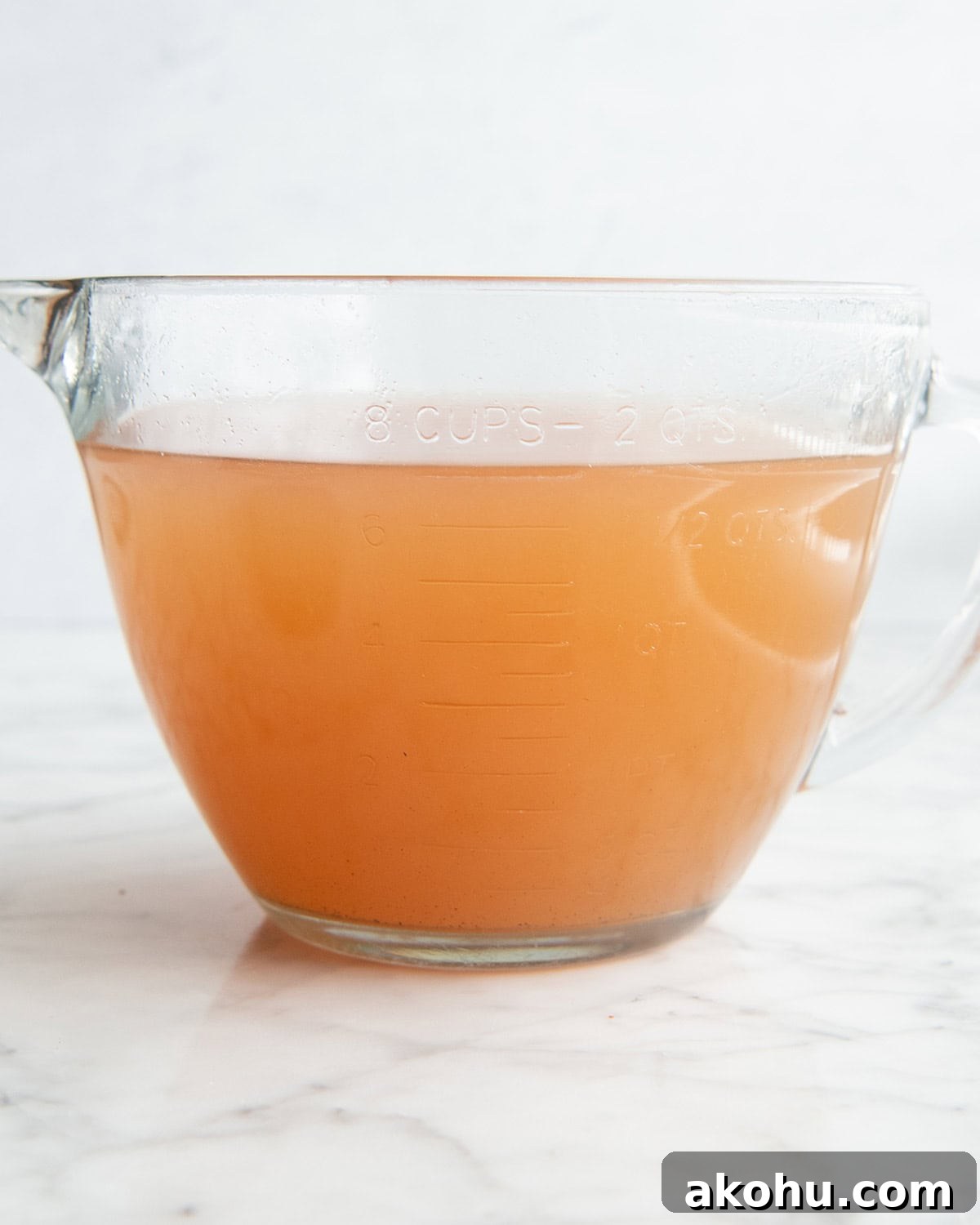 apple cider in a 8 cup glass measuring cup 