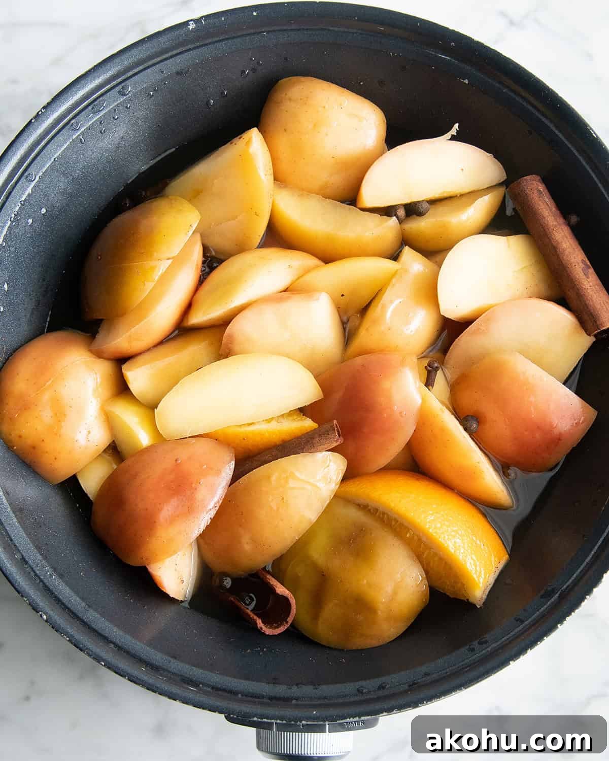 how to make apple cider recipe - ingredients in the crock pot after cooking for 4 hours