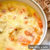 A close up of the Instant Pot Ham and potato soup with no spoon in the bowl