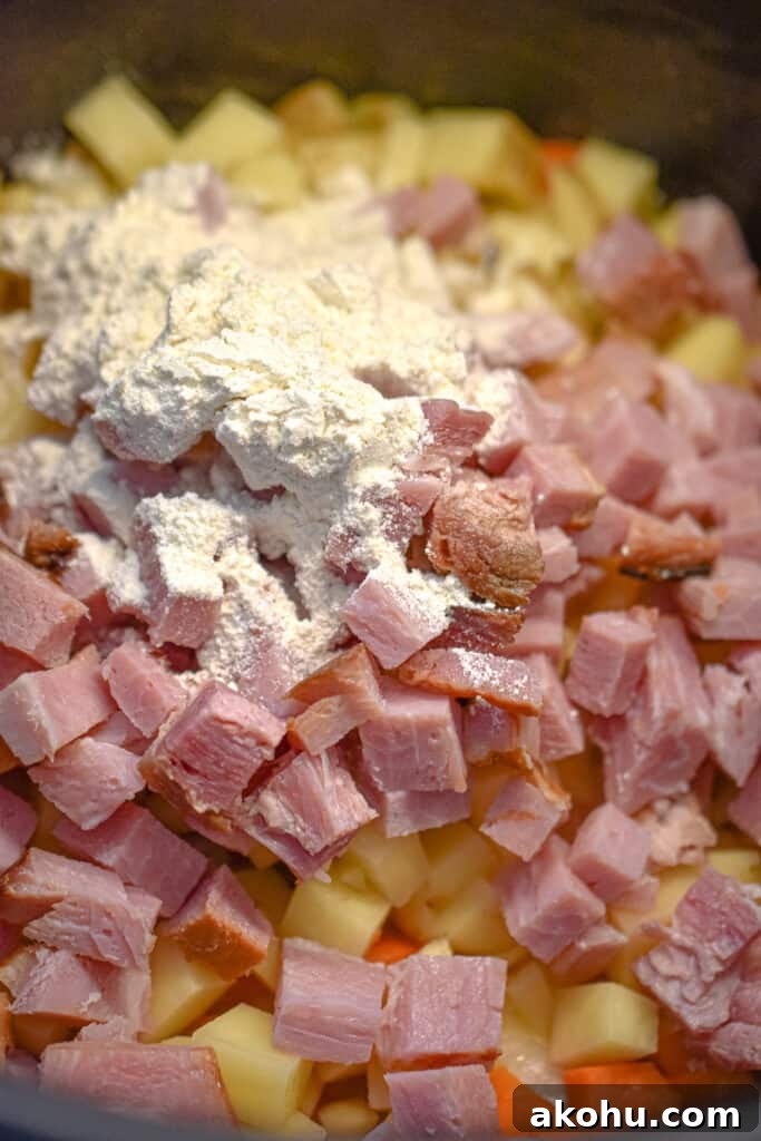 The ham and flour are added to the Instant pot with the chicken broth