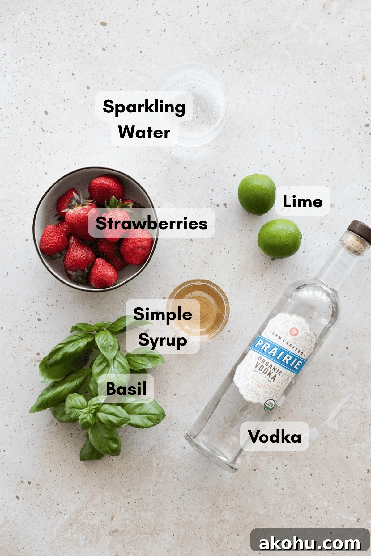 Ingredients for a strawberry basil vodka cocktail. 
