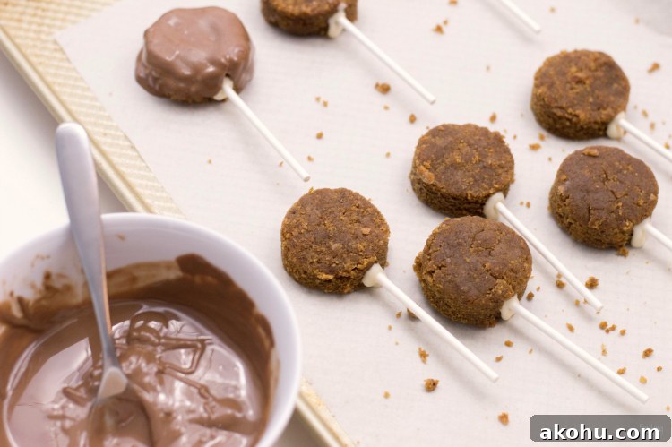 These gingerbread cake pops are sure to bring smiles this holiday season! Made from homemade gingerbread cake, these cake pops feature a sweet gingerbread man face that is as fun as it is delicious! This recipe makes a great Christmas dessert for all ages.