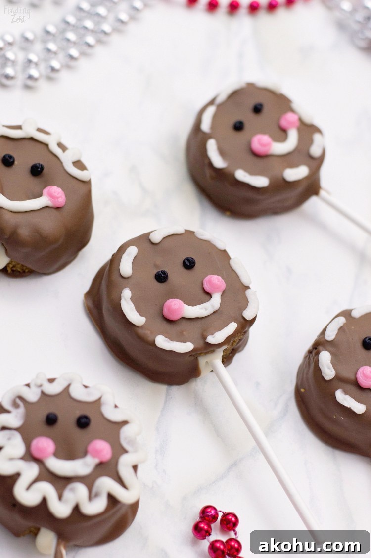 These gingerbread cake pops are sure to bring smiles this holiday season! Made from homemade gingerbread cake, these cake pops feature a sweet gingerbread man face that is as fun as it is delicious! This recipe makes a great Christmas dessert for all ages.
