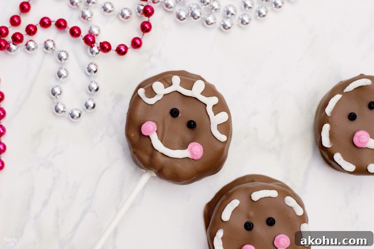 These gingerbread cake pops are sure to bring smiles this holiday season! Made from homemade gingerbread cake, these cake pops feature a sweet gingerbread man face that is as fun as it is delicious! This recipe makes a great Christmas dessert for all ages.