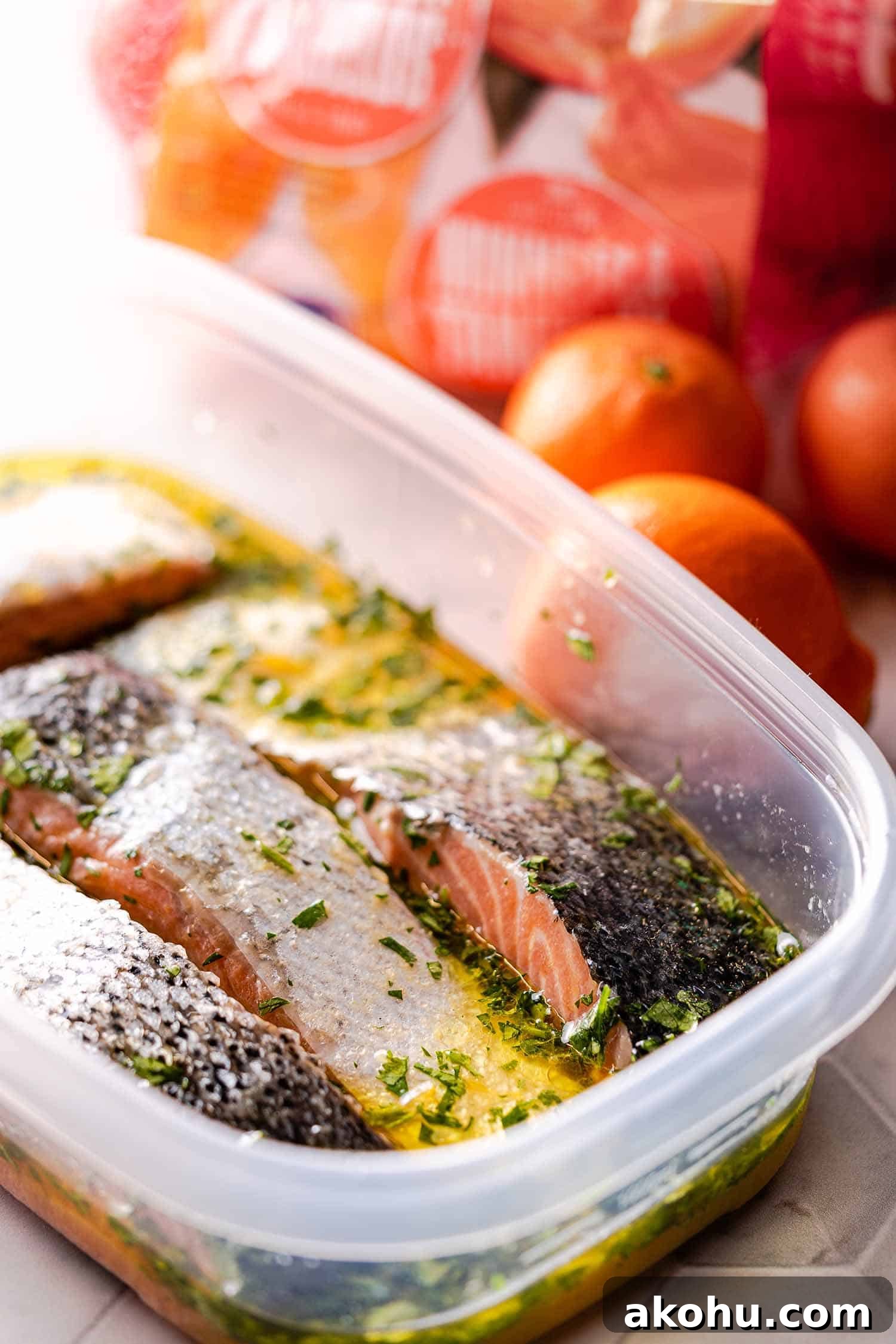 Citrus-Herb Salmon with Orange and Red Onion Salsa 7 salmon marinating in plastic container