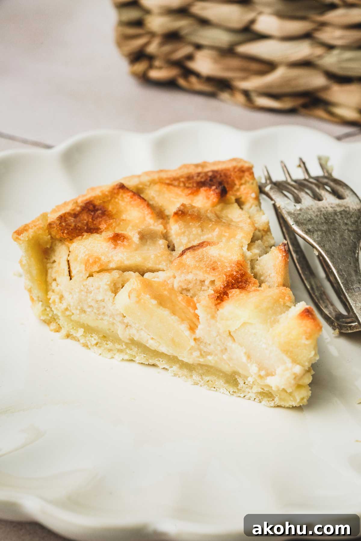 Classic French Tarte Normande: Rustic Normandy Apple Tart Recipe 8 sliced apple tart on a plate