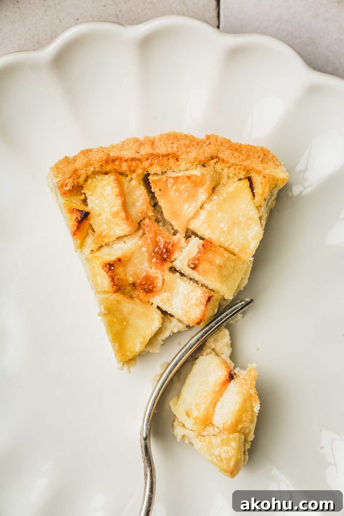 Classic French Tarte Normande: Rustic Normandy Apple Tart Recipe 13 sliced apple tart with a fork