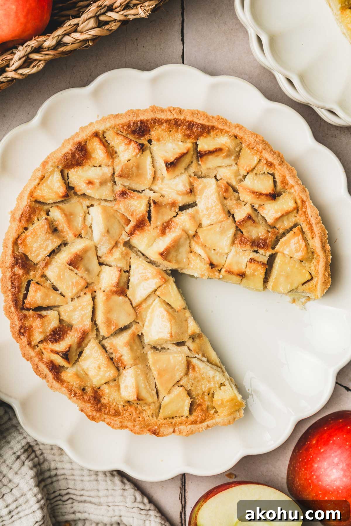 Classic French Tarte Normande: Rustic Normandy Apple Tart Recipe 3 apple tart sliced on a plate
