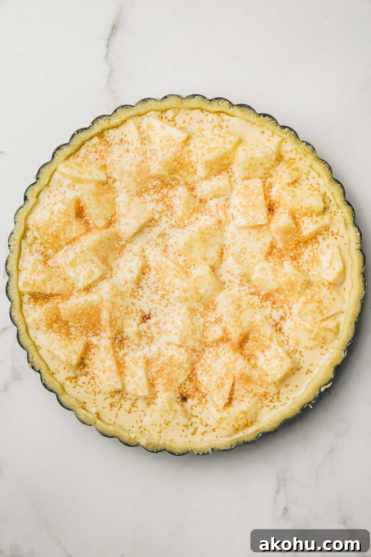 Classic French Tarte Normande: Rustic Normandy Apple Tart Recipe 5 french apple tart on a tart pan before baking
