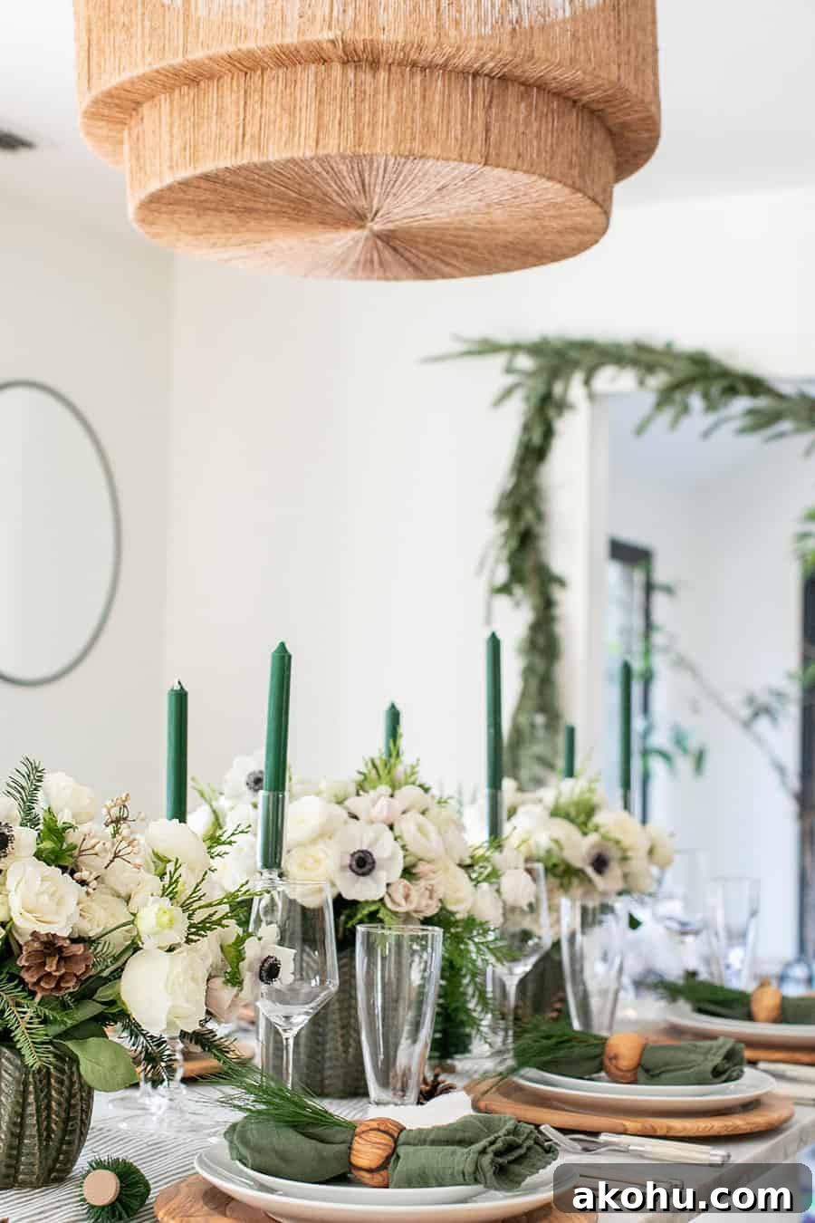 Green and white woodsy Christmas table decorations.