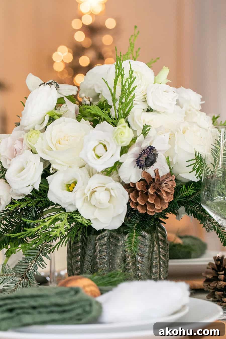 Christmas flowers in a a green Hobby Lobby vase.