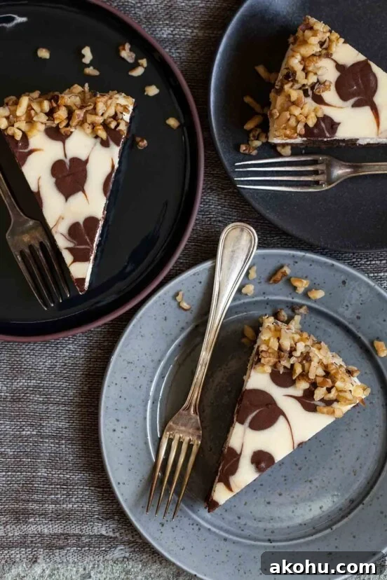 Basque Cheesecake with Tangy Pomegranate Molasses Glaze 14 Three pieces of Junior's brownie swirl cheesecake on separate plates, each with a fork.
