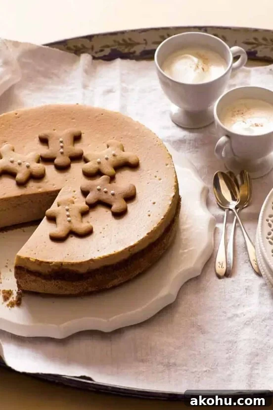 Basque Cheesecake with Tangy Pomegranate Molasses Glaze 15 A whole gingerbread cheesecake on a white platter with a slice missing from it.