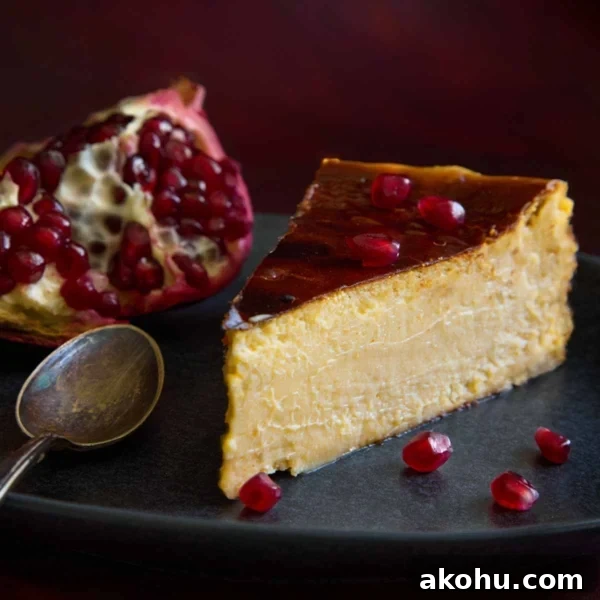 Basque Cheesecake with Tangy Pomegranate Molasses Glaze 18 A slice of burnt Basque cheesecake with pomegranate, ready to be enjoyed.