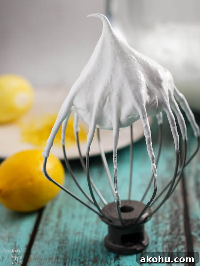 Lemon Meringue cookie batter on a whisk.